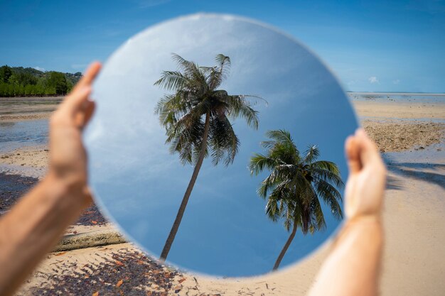 Mirror background with hands outdoors