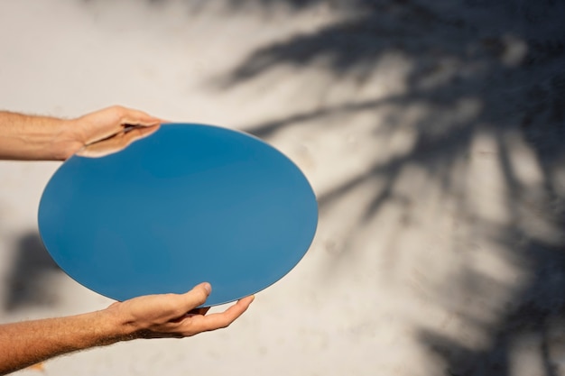 Mirror background with hands outdoors