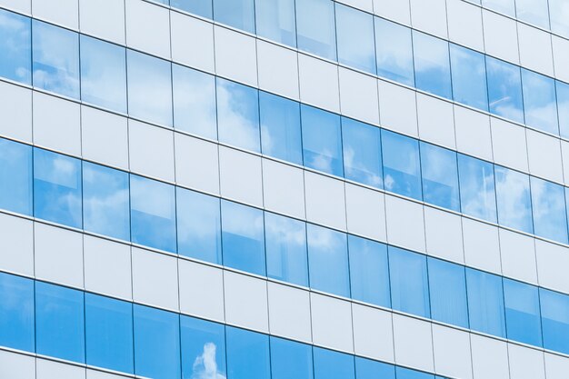 mirrored facade grid cloud downtown