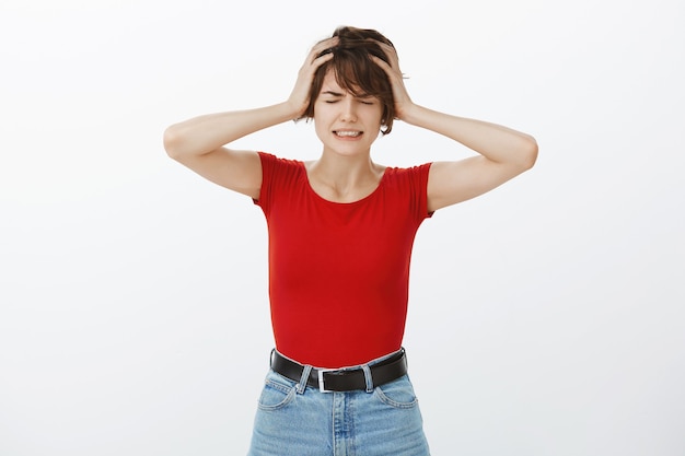 Free photo miserable crying woman having complicated situation, shaking head frustrated