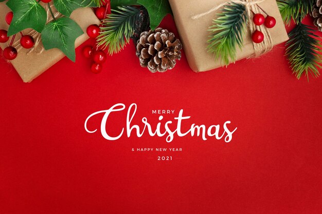 Mistletoe, pine cones and gifts on red table Christmas greeting