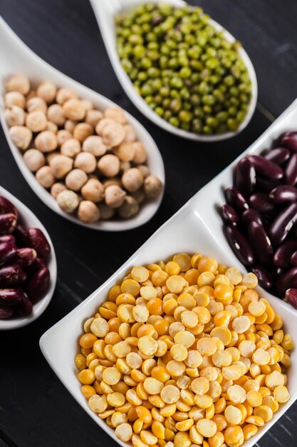 Mix of beans on wooden table