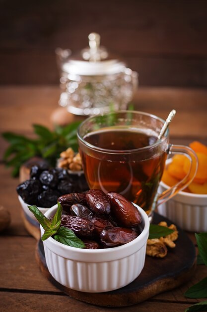 Mix dried fruits (date palm fruits, prunes, dried apricots, raisins) and nuts, and traditional Arabic tea. Ramadan (Ramazan) food.