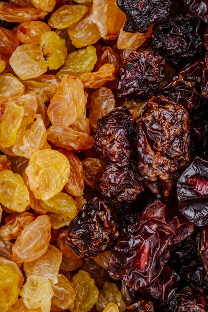 Mix of dried fruits golden raisins with cherries top view