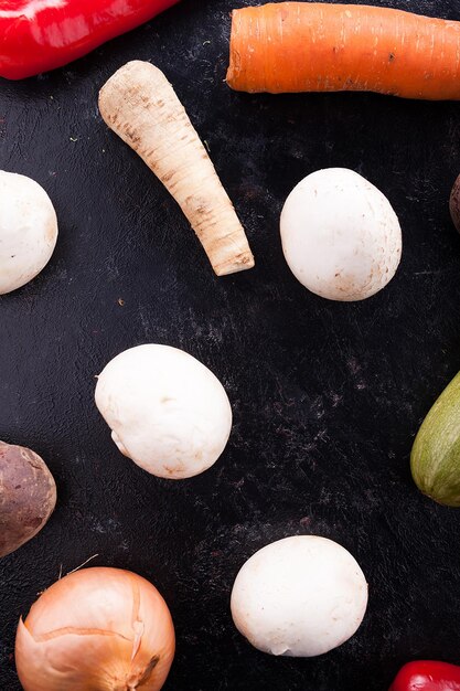 Mix of fresh vegetables on a wooden dark table