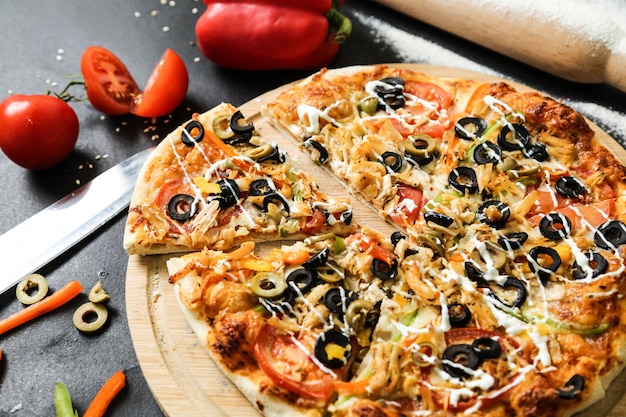 Mix pizza olives bell pepper cheese mushrooms top view