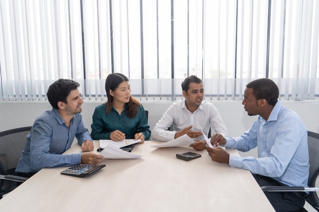 Mix raced business partners meeting in conference room.