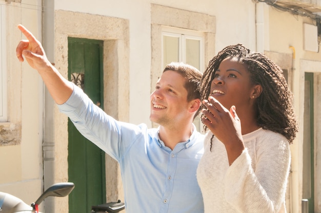 Mix raced couple of travelers impressed with old city