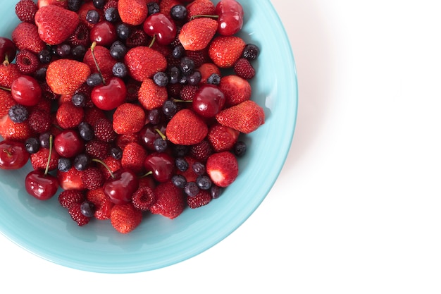 Mixed berries on a blue dish 