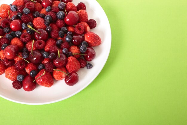 Mixed berries on white plate 