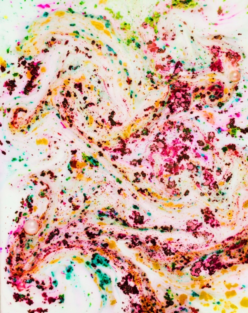 Free photo mixed color powder in liquid on white background