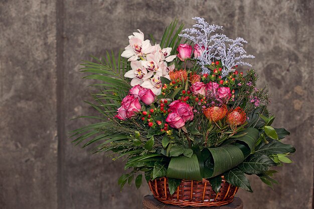 Mixed flower bouquet inside bamboo basket