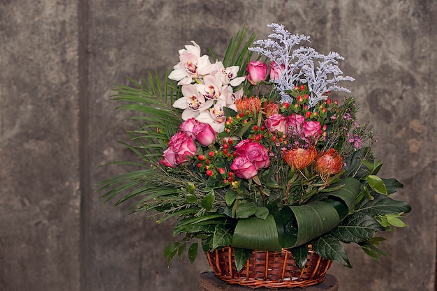 Mixed flower bouquet inside bamboo basket