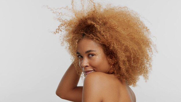 Mixed race black blonde model with curly hair on white afro blonde hair