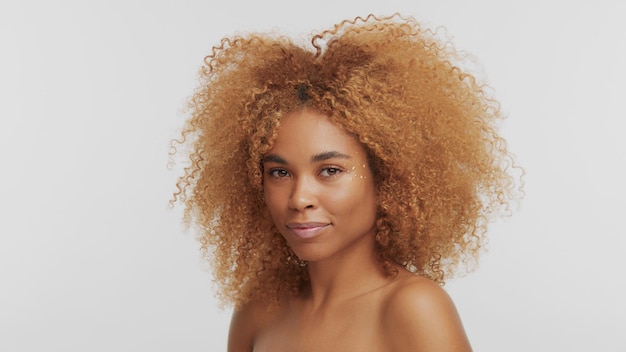 Mixed race black blonde model with curly hair on white afro blonde hair