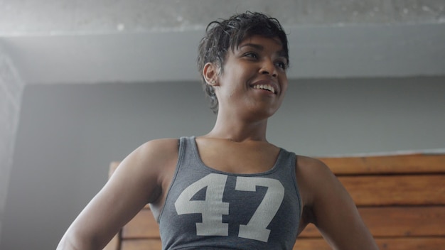 Free photo mixed rae african american woman has a rest during her workout breathing deep body parts