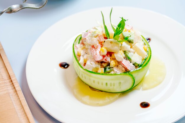 Mixed salad ornated with cucumber