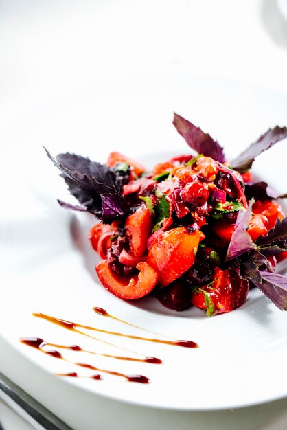 Mixed salad topped with basil