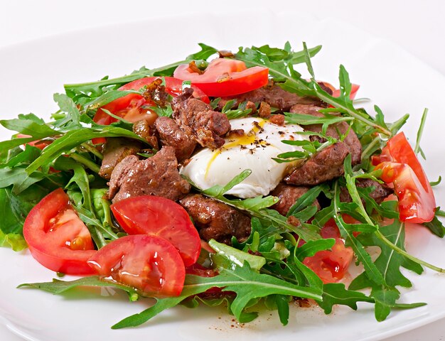 Mixed salad with chicken liver and egg Pochet