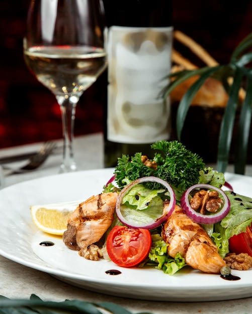 Mixed salad with herbs and fried fish