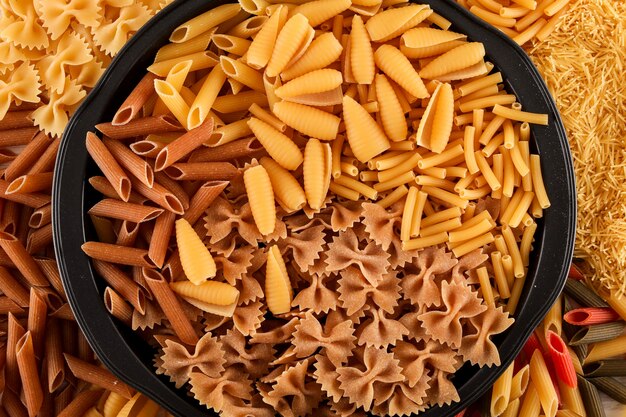 mixed various pasta types top view