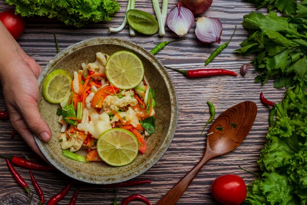 Mixed vegetable and chicken feet , Thai spicy salad.