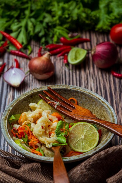 Mixed vegetable and chicken feet , Thai spicy salad.