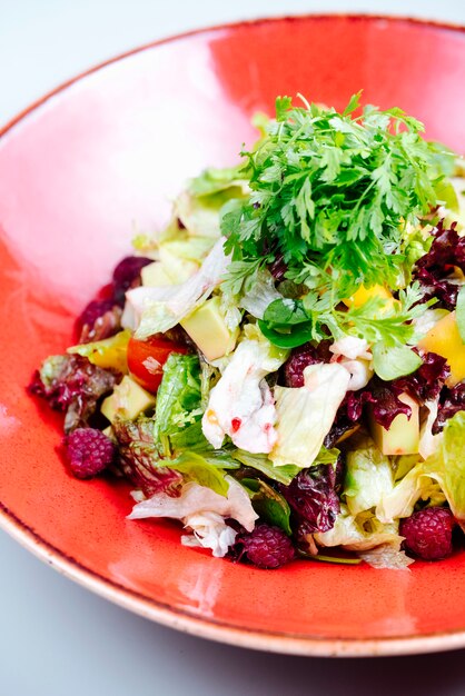 Mixed vegetable salad filled with berries