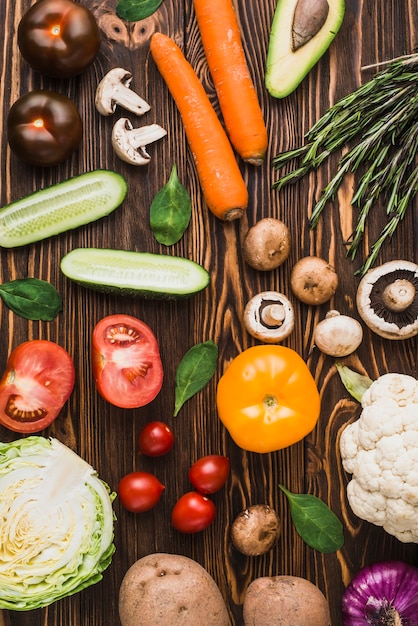 Mixed vegetables and herbs on lumber table