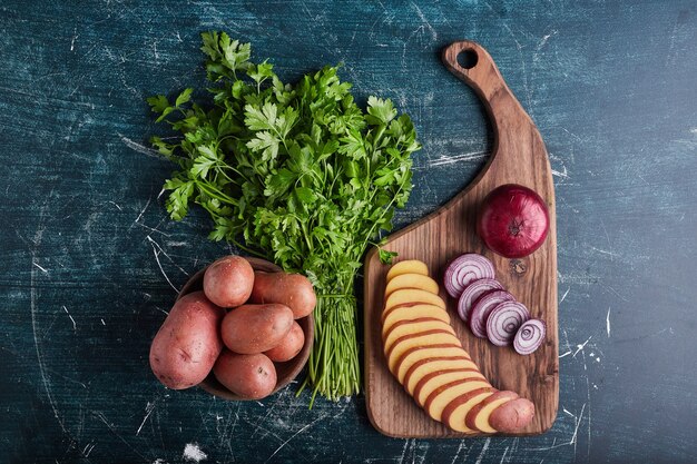 Mixed vegetables on a wooden board.