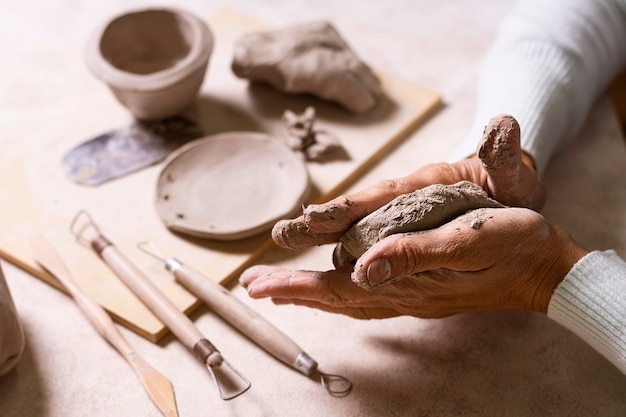 Mixing clay for pottery pot