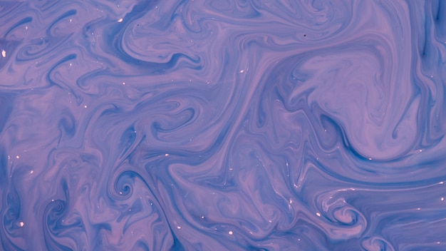 Mixing purple paint abstract background