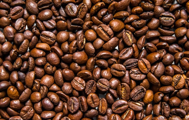 Mixture of different kinds of coffee beans. Coffee Background. roasted coffee beans. coffee beans isolated on white background