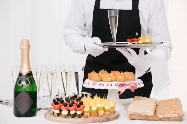 Mixture of snacks and drinks on table