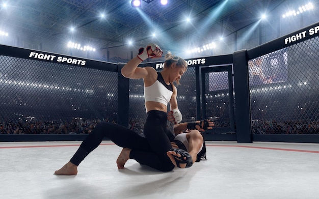 Free photo mma female fighters on professional ring