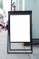 Free photo mobile mock-up billboard on sidewalk