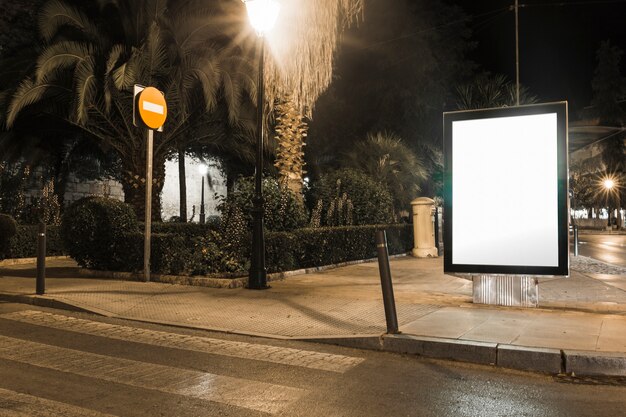 Mock up of blank advertising light box in the city