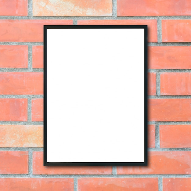 Mock up blank poster picture frame on brick wall.