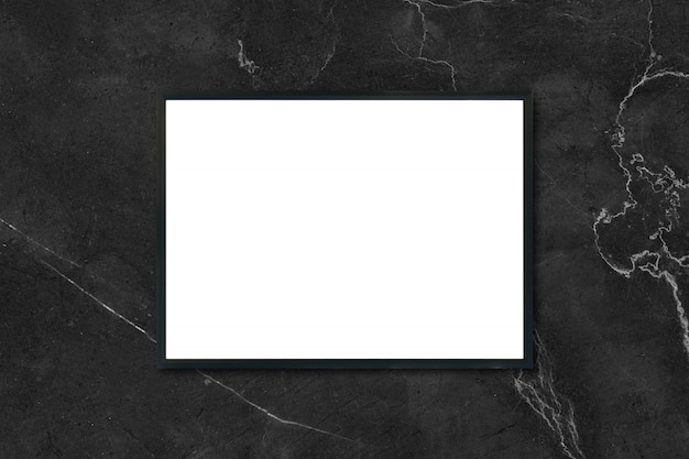 Mock up blank poster picture frame hanging on black marble wall in room - can be used mockup for montage products display and design key visual layout.