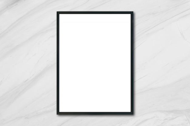 Mock up blank poster picture frame hanging on white marble wall in room - can be used mockup for montage products display and design key visual layout.