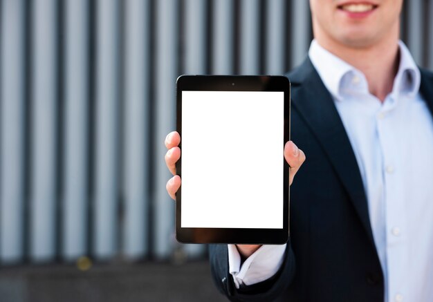 Mock-up businessman holding tablet