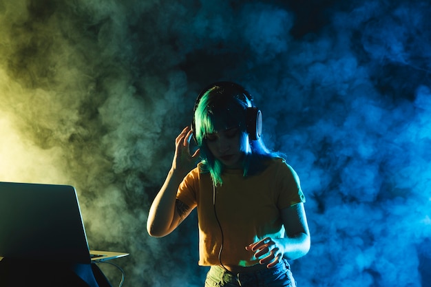 Mock-up female dj mixing in club