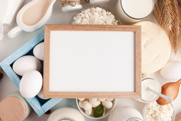 Mock-up frame surrounded by dairy products