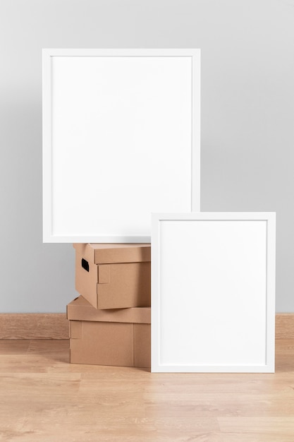 Mock up frames beside cardboard boxes