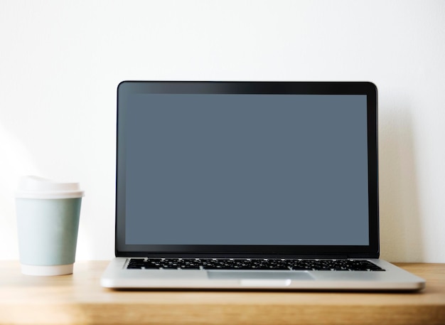 Mockup computer laptop on wooden table