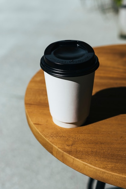 Free photo mockup of a disposable cup of coffee