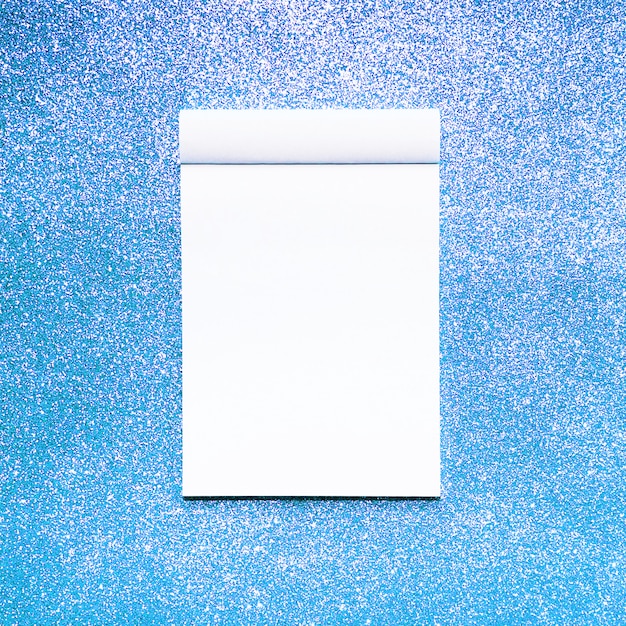 Mockup notebook with blue glitter background