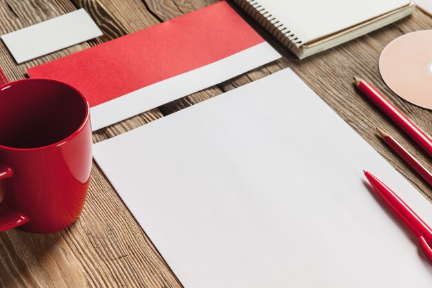 The mockup on wooden with red calculator