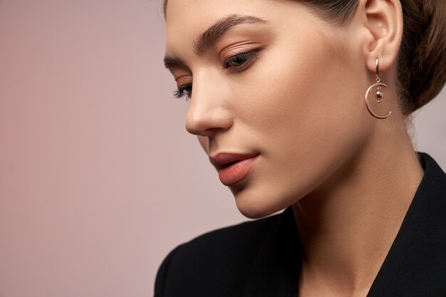Model demonstrating earrings
