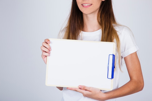 Model holding a clipboard